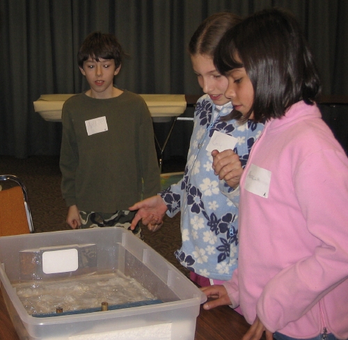 Heatherwood students perform a tsunami wave tank experiment.