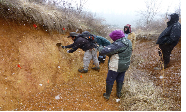 students examining trench; Credit: Randal Cox