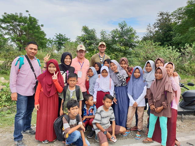 Mason in Palu with children