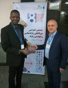 Akande Receiving a Souvenir from Dr. Farokh Parsizadeh