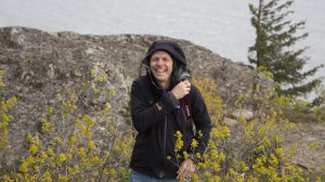 Paul Friberg in a field of yellow flowers