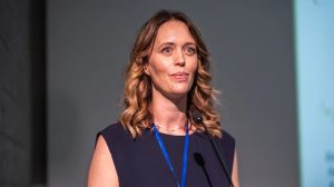 Helen Crowley standing at podium