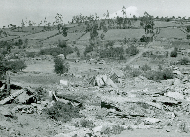 b&w image of ruined homes in Ruins of Pelileo in Ambato — after the 1949 Ambato earthquake in Ecuador