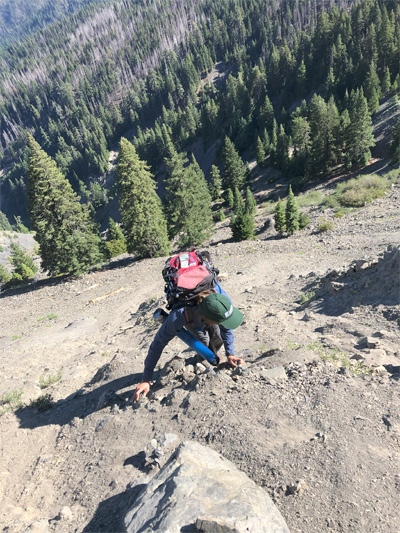 Jessie Pearl climbs out of Mule Slide debris avalanche.